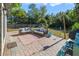 Relaxing backyard patio with brick pavers and seating area at 59 Pine Dr, Debary, FL 32713