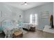 Two twin beds, a window, and coastal decor at 608 Gran Bahama Blvd # 608, Davenport, FL 33897