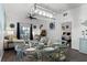 Dining area with glass-top table and light blue chairs, open to living room at 608 Gran Bahama Blvd # 608, Davenport, FL 33897