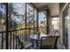 Screened porch with outdoor furniture and a view of nature at 608 Gran Bahama Blvd # 608, Davenport, FL 33897