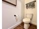 Simple bathroom with toilet and dark accents at 6406 Rover Way, St Cloud, FL 34771