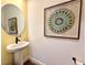 Stylish powder room with pedestal sink at 6406 Rover Way, St Cloud, FL 34771