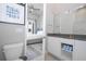 Modern bathroom with double vanity and view into bedroom at 7740 Sandy Ridge Dr # 9-236, Kissimmee, FL 34747