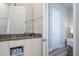 Bright bathroom with vanity and a door to bedroom at 7740 Sandy Ridge Dr # 9-236, Kissimmee, FL 34747