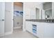 Modern bathroom with double vanity and gray countertop at 7740 Sandy Ridge Dr # 9-236, Kissimmee, FL 34747