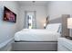 Bedroom with a king-size bed, TV and window coverings at 7740 Sandy Ridge Dr # 9-236, Kissimmee, FL 34747