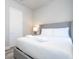 Spacious bedroom with a king-size bed and en-suite bathroom at 7740 Sandy Ridge Dr # 9-236, Kissimmee, FL 34747