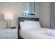 Bedroom with a full-size bed, nightstand, and window at 7740 Sandy Ridge Dr # 9-236, Kissimmee, FL 34747