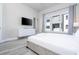 Comfortable bedroom with large windows, dresser, and a TV at 7740 Sandy Ridge Dr # 9-236, Kissimmee, FL 34747