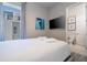 Comfortable bedroom with a queen bed, TV, and en-suite bathroom at 7740 Sandy Ridge Dr # 9-236, Kissimmee, FL 34747