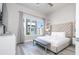 Main bedroom with king-size bed and large window at 7740 Sandy Ridge Dr # 9-236, Kissimmee, FL 34747