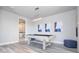 Game room with pool table, modern art, and adjacent bathroom at 7740 Sandy Ridge Dr # 9-236, Kissimmee, FL 34747