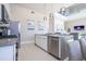 Modern kitchen features stainless steel appliances and a large island at 7740 Sandy Ridge Dr # 9-236, Kissimmee, FL 34747