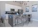 Modern kitchen with stainless steel appliances and an island at 7740 Sandy Ridge Dr # 9-236, Kissimmee, FL 34747
