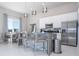 Modern kitchen with stainless steel appliances and an island at 7740 Sandy Ridge Dr # 9-236, Kissimmee, FL 34747