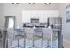 Modern kitchen with stainless steel appliances and an island at 7740 Sandy Ridge Dr # 9-236, Kissimmee, FL 34747