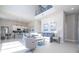 Open concept living room with high ceilings and kitchen access at 7740 Sandy Ridge Dr # 9-236, Kissimmee, FL 34747