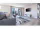 Spacious living room with access to balcony and flat-screen TV at 7740 Sandy Ridge Dr # 9-236, Kissimmee, FL 34747