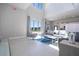 Modern living room with high ceilings and city views at 7740 Sandy Ridge Dr # 9-236, Kissimmee, FL 34747
