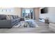 Living room with sectional sofa, large rug and access to balcony at 7740 Sandy Ridge Dr # 9-236, Kissimmee, FL 34747
