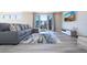 Living room with sectional sofa, large rug and access to balcony at 7740 Sandy Ridge Dr # 9-236, Kissimmee, FL 34747