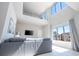 Spacious living room with high ceilings and large windows at 7740 Sandy Ridge Dr # 9-236, Kissimmee, FL 34747