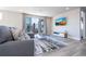 Spacious living room with access to balcony and flat-screen TV at 7740 Sandy Ridge Dr # 9-236, Kissimmee, FL 34747