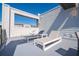 Serene rooftop deck with lounge chairs and small table at 7740 Sandy Ridge Dr # 9-236, Kissimmee, FL 34747