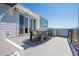 Rooftop deck with dining area and partial view of community at 7740 Sandy Ridge Dr # 9-236, Kissimmee, FL 34747