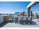 Outdoor dining area on rooftop deck with grill and views at 7740 Sandy Ridge Dr # 9-236, Kissimmee, FL 34747