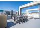 Modern rooftop deck with dining area and grilling station at 7740 Sandy Ridge Dr # 9-236, Kissimmee, FL 34747