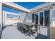 Spacious rooftop deck with dining furniture and lounge chairs at 7740 Sandy Ridge Dr # 9-236, Kissimmee, FL 34747