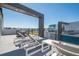 Relaxing rooftop deck with lounge chairs and city views at 7740 Sandy Ridge Dr # 9-236, Kissimmee, FL 34747