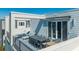 Spacious rooftop deck with dining furniture and grill at 7740 Sandy Ridge Dr # 9-236, Kissimmee, FL 34747