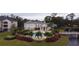 Aerial view of community building, pool, and landscaping at 940 Village Trl # 9-303, Port Orange, FL 32127