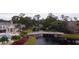 Wooden bridge over a waterway in a community setting at 940 Village Trl # 9-303, Port Orange, FL 32127