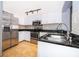 Modern kitchen features stainless steel appliances and granite countertops at 102 Vista Verdi Cir # 336, Lake Mary, FL 32746