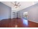 Living room with hardwood floors and access to balcony at 102 Vista Verdi Cir # 336, Lake Mary, FL 32746