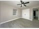 Spacious bedroom with ceiling fan and double door closet at 1048 Wakefield Cir, Deltona, FL 32725