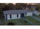 House exterior with gray roof, white siding, and stone accents at 1048 Wakefield Cir, Deltona, FL 32725