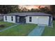 Updated home exterior boasts a fresh coat of paint and well-maintained landscaping at 1048 Wakefield Cir, Deltona, FL 32725
