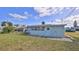 Spacious backyard with grassy lawn and partial view of home at 11 Azalea Dr, Ormond Beach, FL 32176