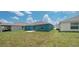 Overlooking the backyard showing a teal house at 1963 Turtle Dove Ln, Kissimmee, FL 34746