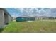 Spacious backyard with teal home and other houses visible at 1963 Turtle Dove Ln, Kissimmee, FL 34746