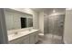 Bathroom boasts double vanity and a large walk-in shower at 1963 Turtle Dove Ln, Kissimmee, FL 34746