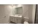 Double sink bathroom with a toilet and mirror at 1963 Turtle Dove Ln, Kissimmee, FL 34746