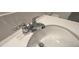 Bathroom sink with chrome faucet and quartz countertop at 1963 Turtle Dove Ln, Kissimmee, FL 34746