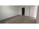 Bedroom with carpet and access to a bathroom at 1963 Turtle Dove Ln, Kissimmee, FL 34746
