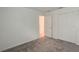 Bright bedroom featuring carpet, double door closet and access to another room at 1963 Turtle Dove Ln, Kissimmee, FL 34746