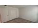 Spacious bedroom with double door closet and neutral carpeting at 1963 Turtle Dove Ln, Kissimmee, FL 34746